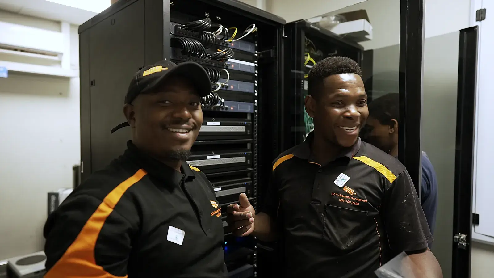 CCTV installation in Durbanville, Western Cape: CCTV Security Surveillance technicians at a CCTV network cabinet they installed