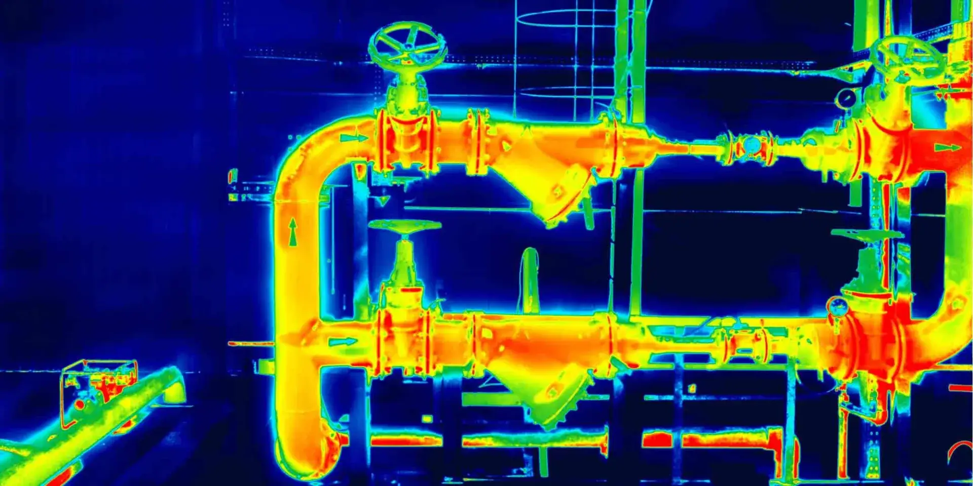 Thermal image of industrial pipework with hot spots shown in red