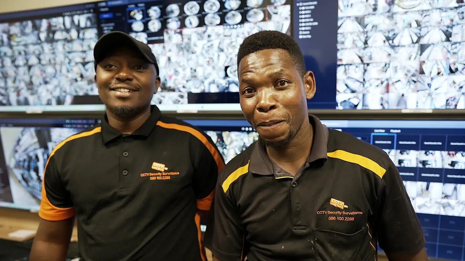 CCTV installation in Bellville, Western Cape: CCTV Security Surveillance technicians at a CCTV monitoring video wall