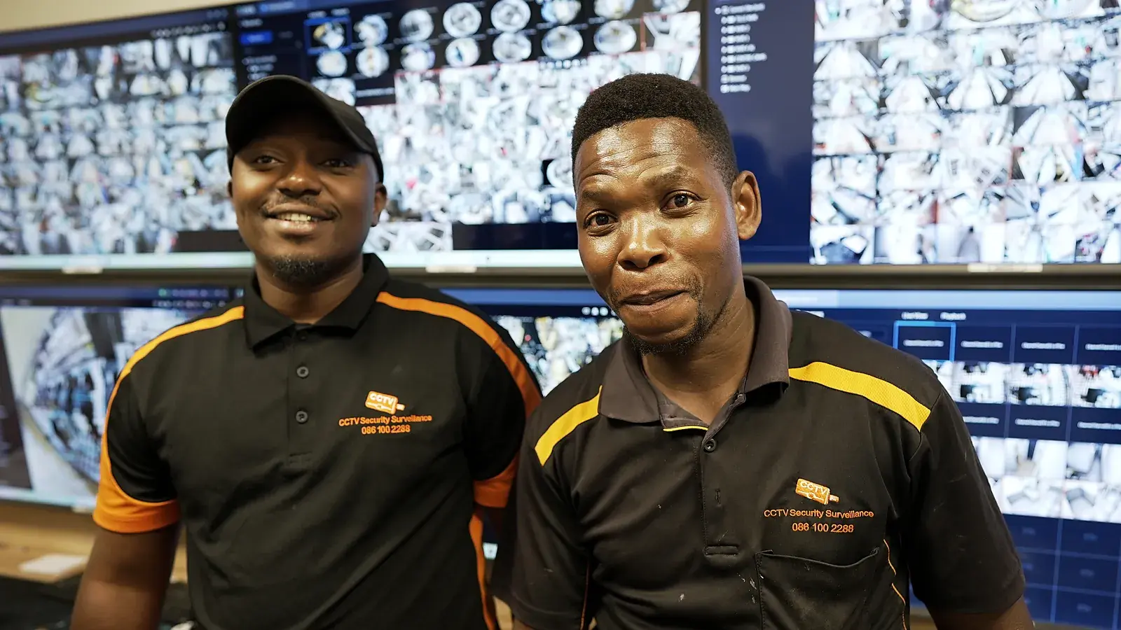 CCTV installation in Bellville, Western Cape: CCTV Security Surveillance technicians at a CCTV monitoring video wall