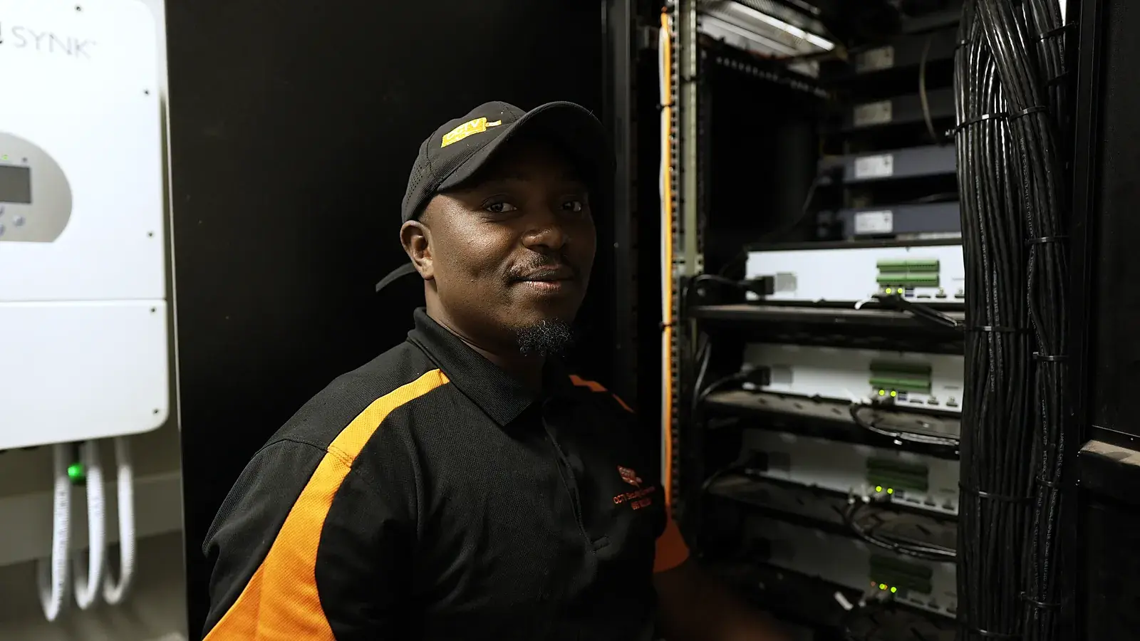CCTV installation in Benoni, Gauteng: CCTV Security Surveillance technician beside a CCTV recorder rack and backup inverter