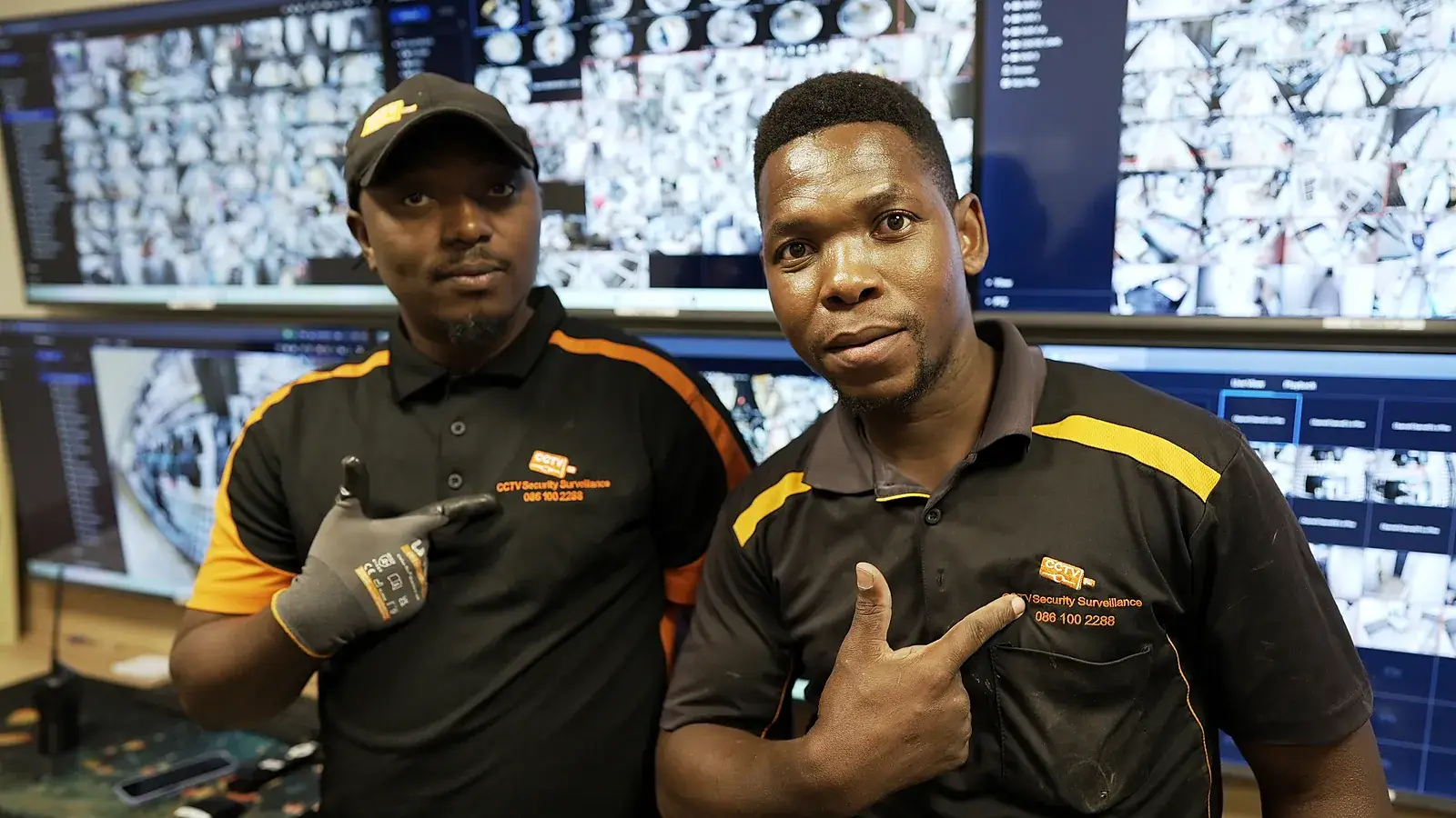 CCTV installation in Century City, Western Cape: CCTV Security Surveillance technicians at a CCTV monitoring video wall