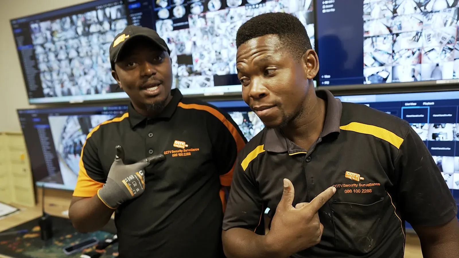 CCTV installation in Coega, Eastern Cape: CCTV Security Surveillance technicians at a CCTV monitoring video wall