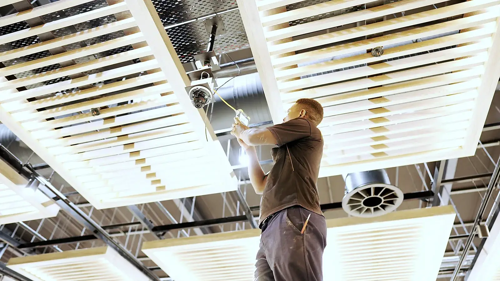 CCTV installation in Kariega, Eastern Cape: CCTV Security Surveillance technician installing a ceiling dome camera