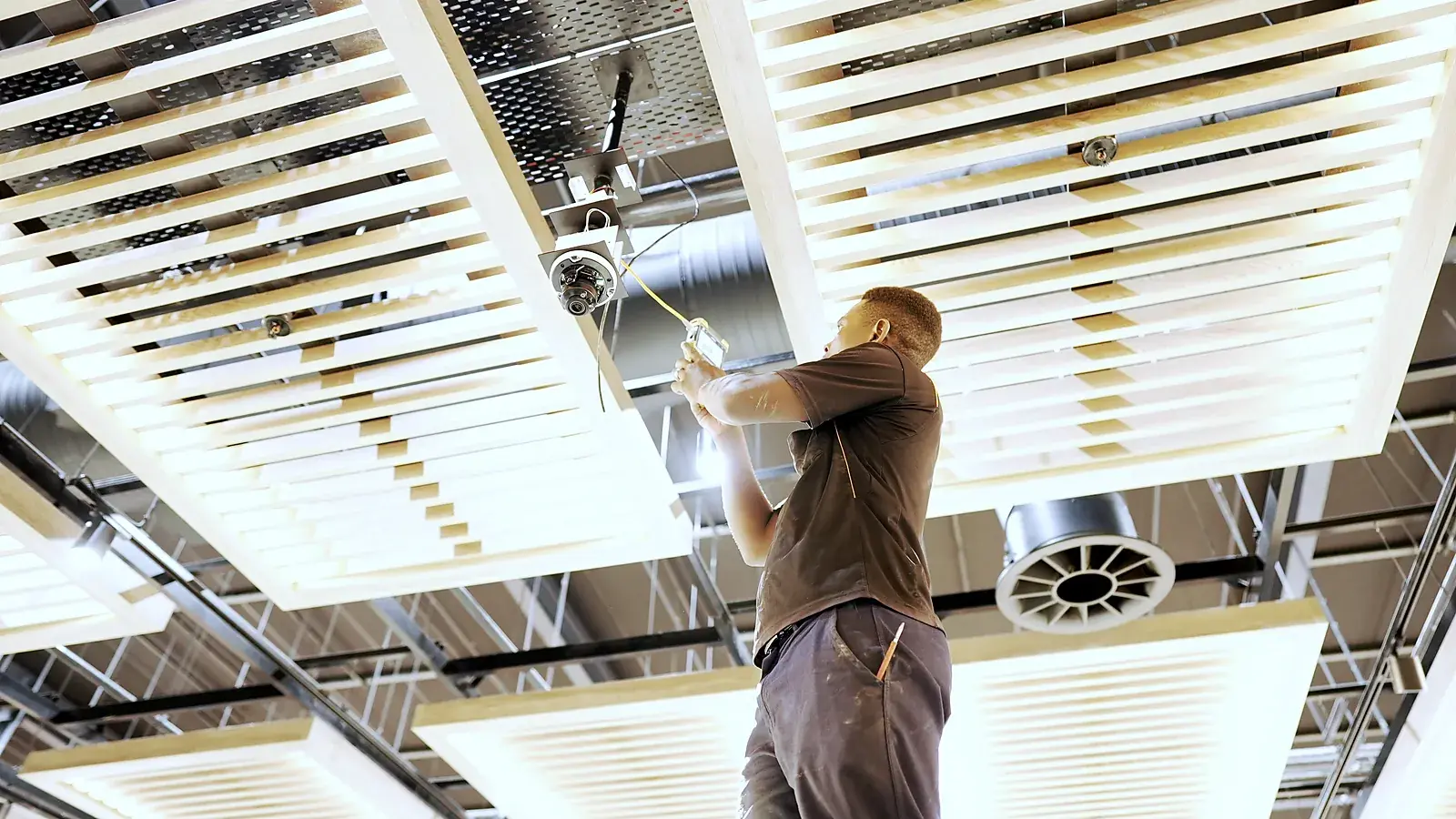 CCTV installation in the Eastern Cape: CCTV Security Surveillance technician installing a ceiling dome camera