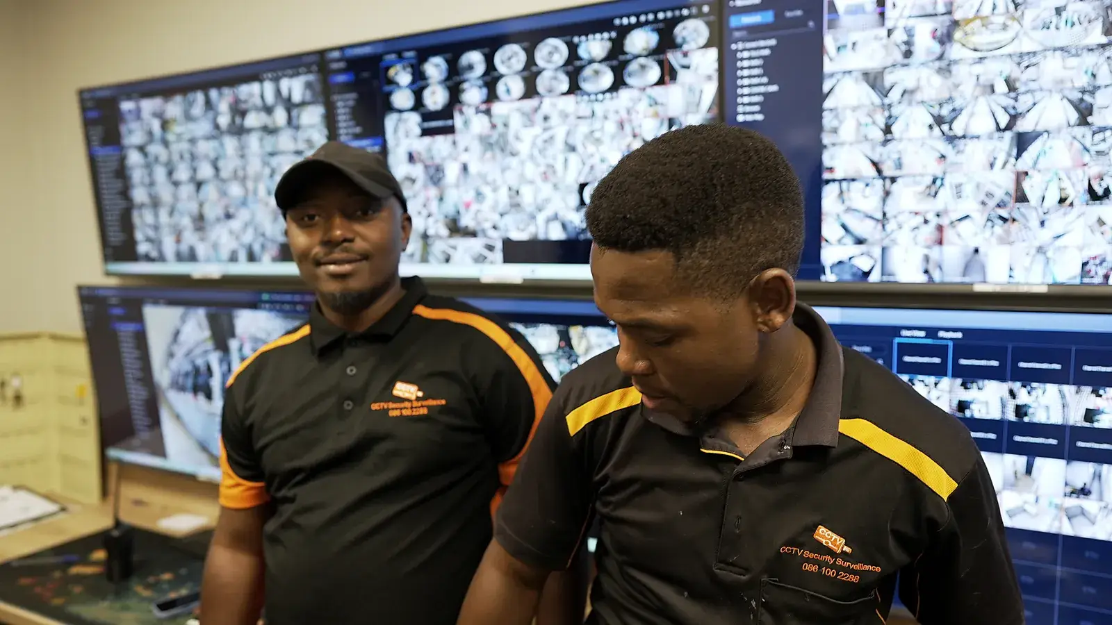 CCTV installation in Komani, Eastern Cape: CCTV Security Surveillance technicians at a CCTV monitoring video wall