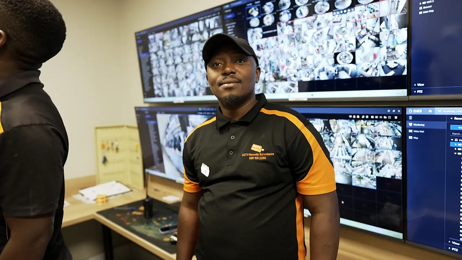 Offsite CCTV monitoring for Gauteng businesses: CCTV Security Surveillance technician at a CCTV monitoring video wall