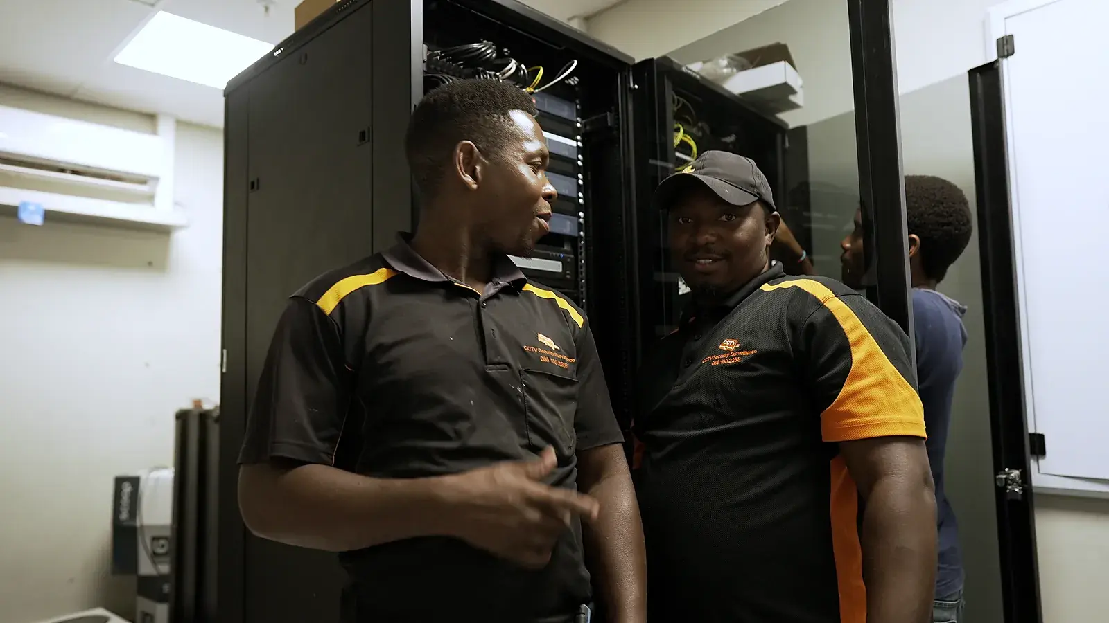 CCTV installation in West Coast, Western Cape: CCTV Security Surveillance technicians at a CCTV network cabinet they installed