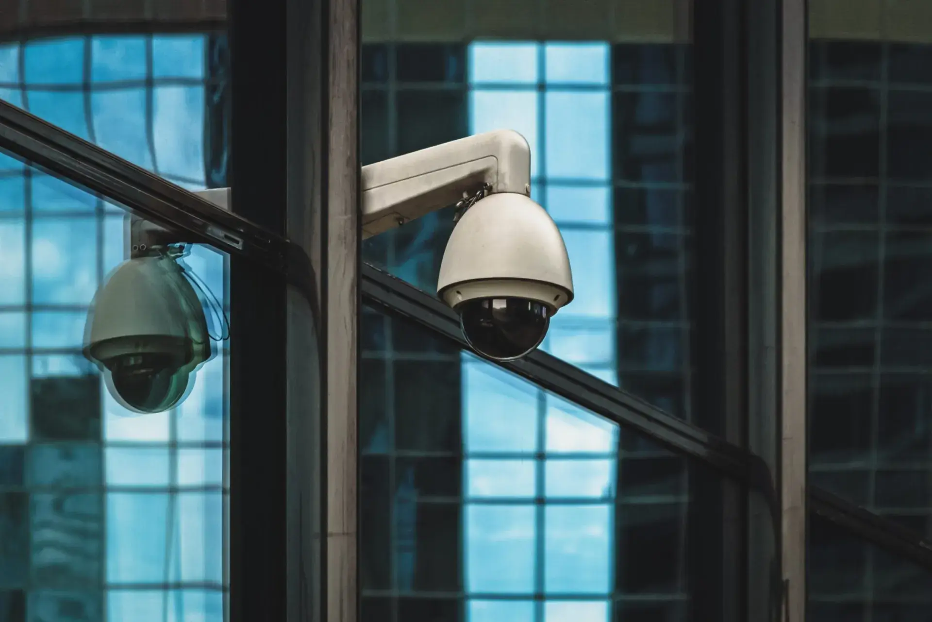 PTZ dome CCTV cameras mounted on a building exterior